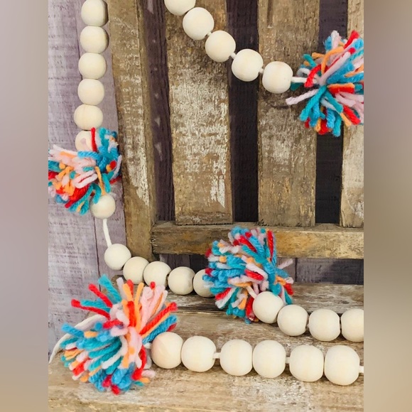 6 Foot Wood Bead Garland with Multi-Colored Yarn Pom Poms - Picture 5 of 9